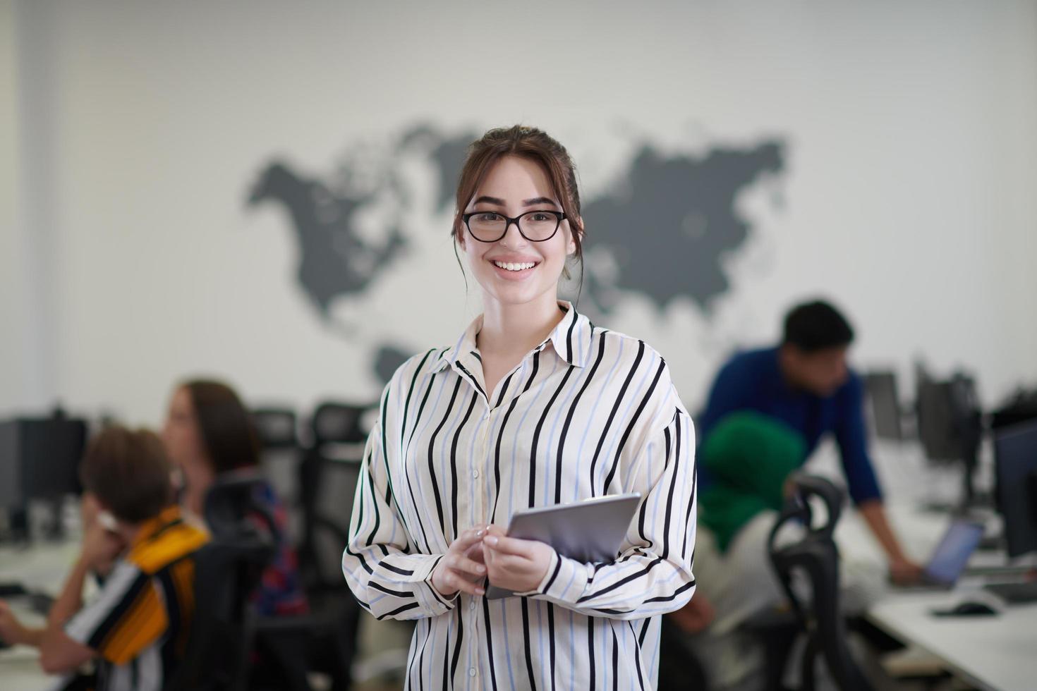 portrait of businesswoman holding tablet computer photo