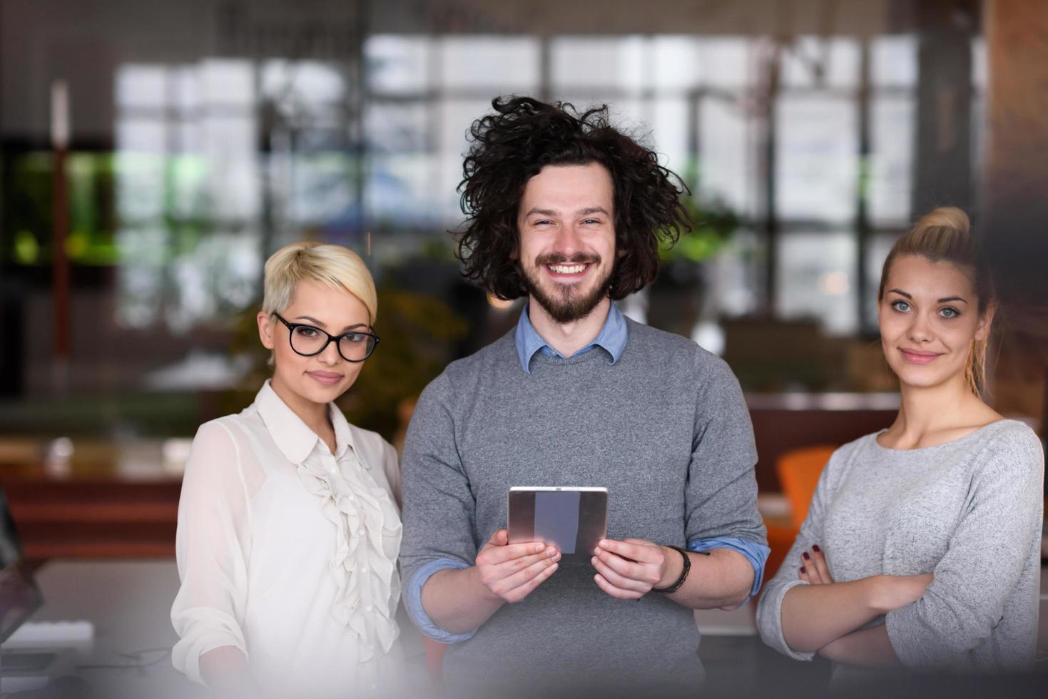 group of Business People Working With Tablet in startup office photo