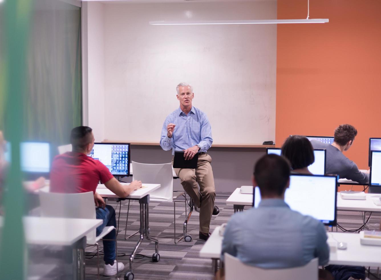 teacher and students in computer lab classroom photo