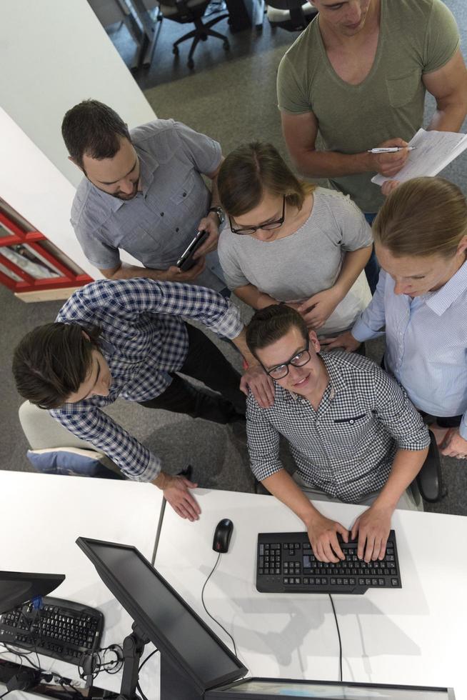 startup business people group working as team to find solution photo