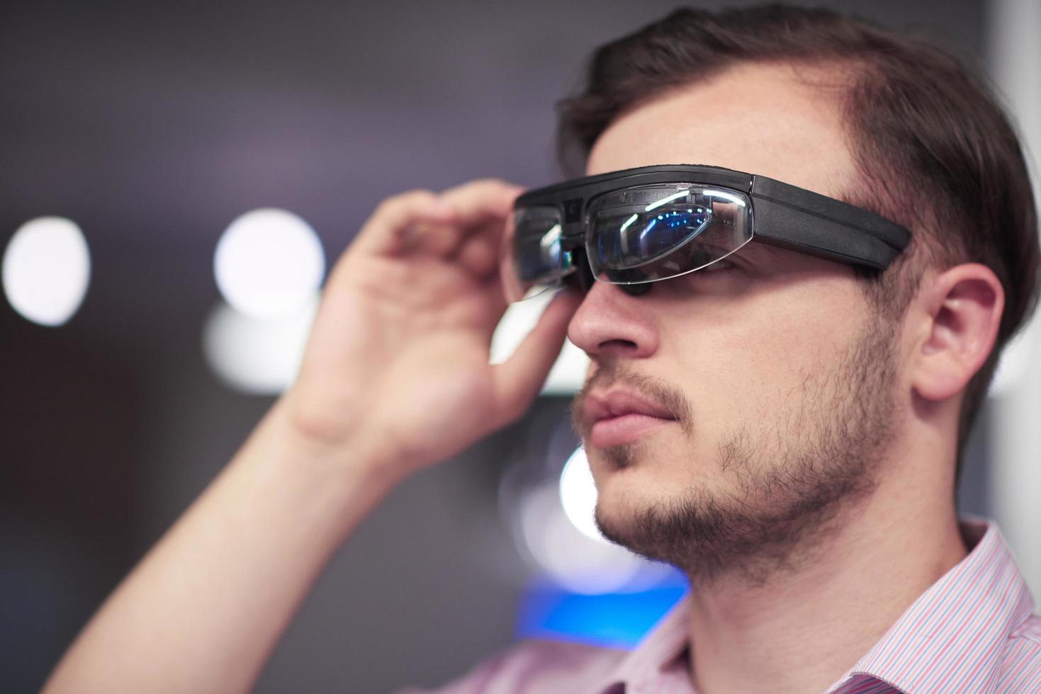 man using virtual reality gadget computer glasses photo