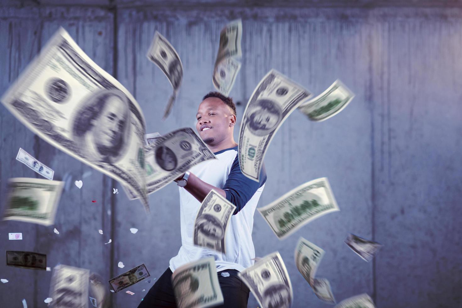 black businessman making the rain of money photo