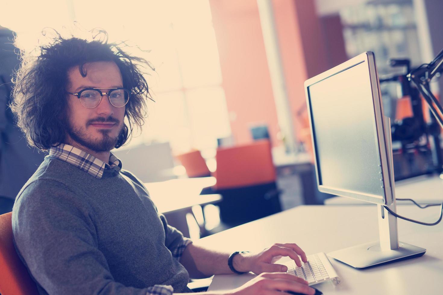 businessman working using a computer in startup office photo