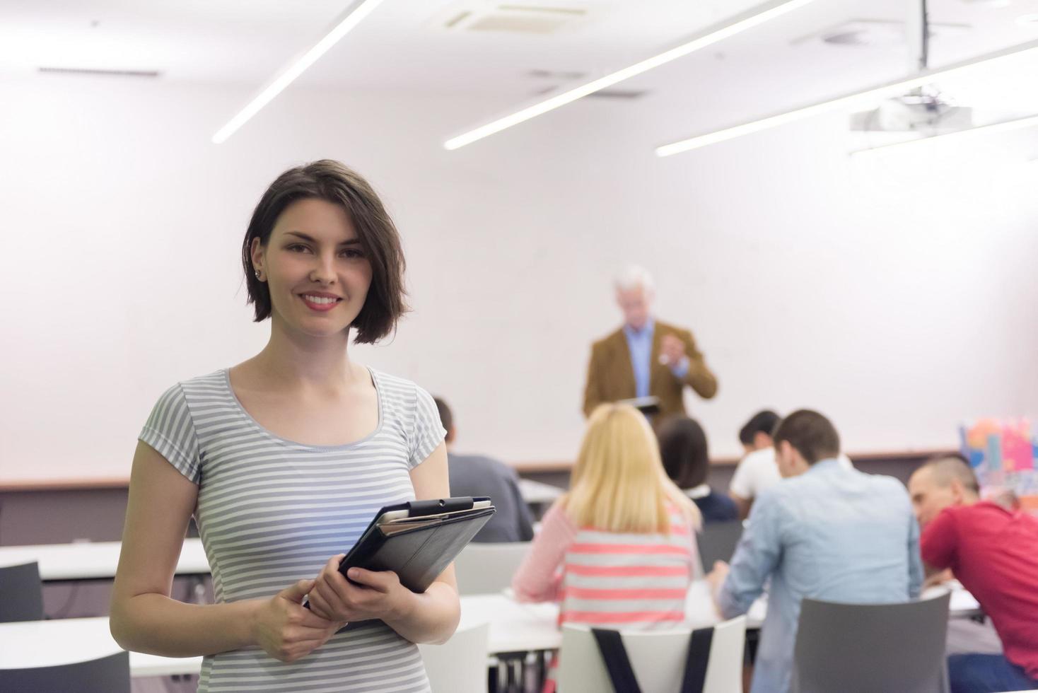 portrait of happy female student in classroom photo