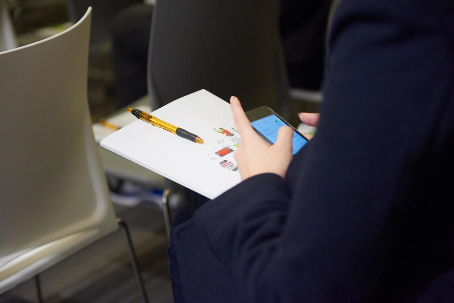 taking notes on business conference photo