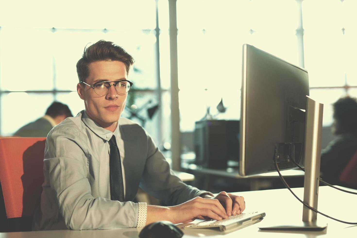 businessman working using a computer in startup office photo