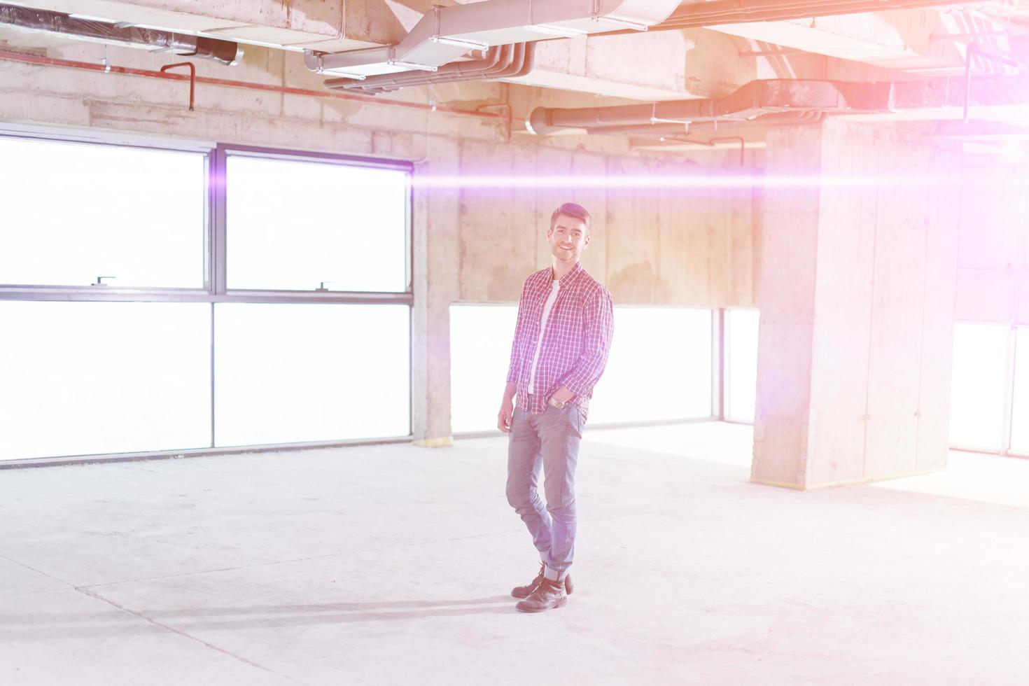 portrait of casual businessman on construction site photo