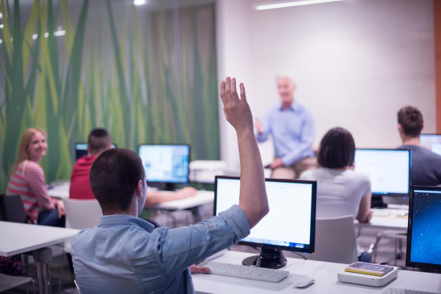 student answering a question in classroom photo