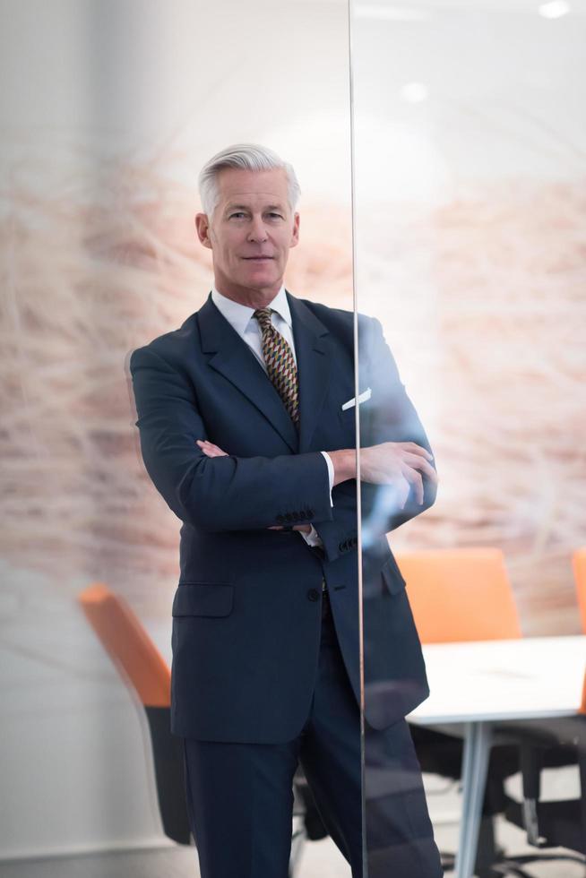 portrait of handsome senior business man at modern office photo