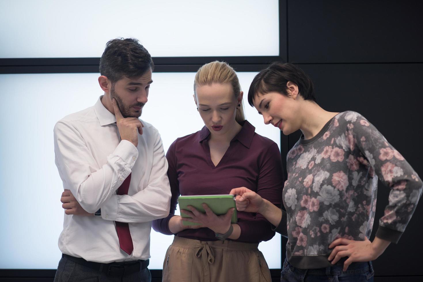 young business people group working on tablet photo