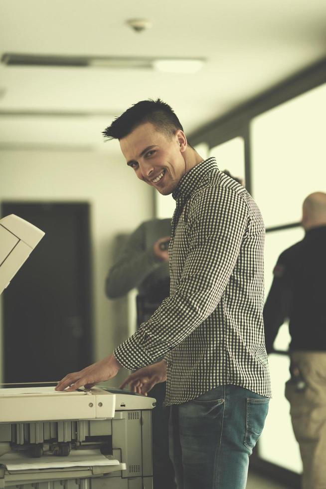 young  business man copy documents photo