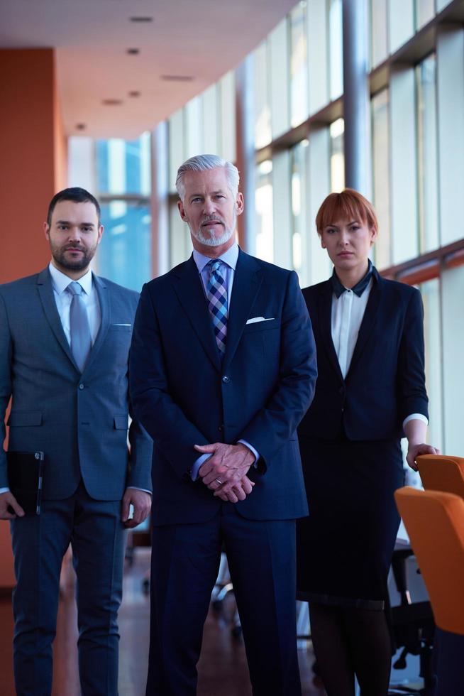 senior business man with his team at office photo