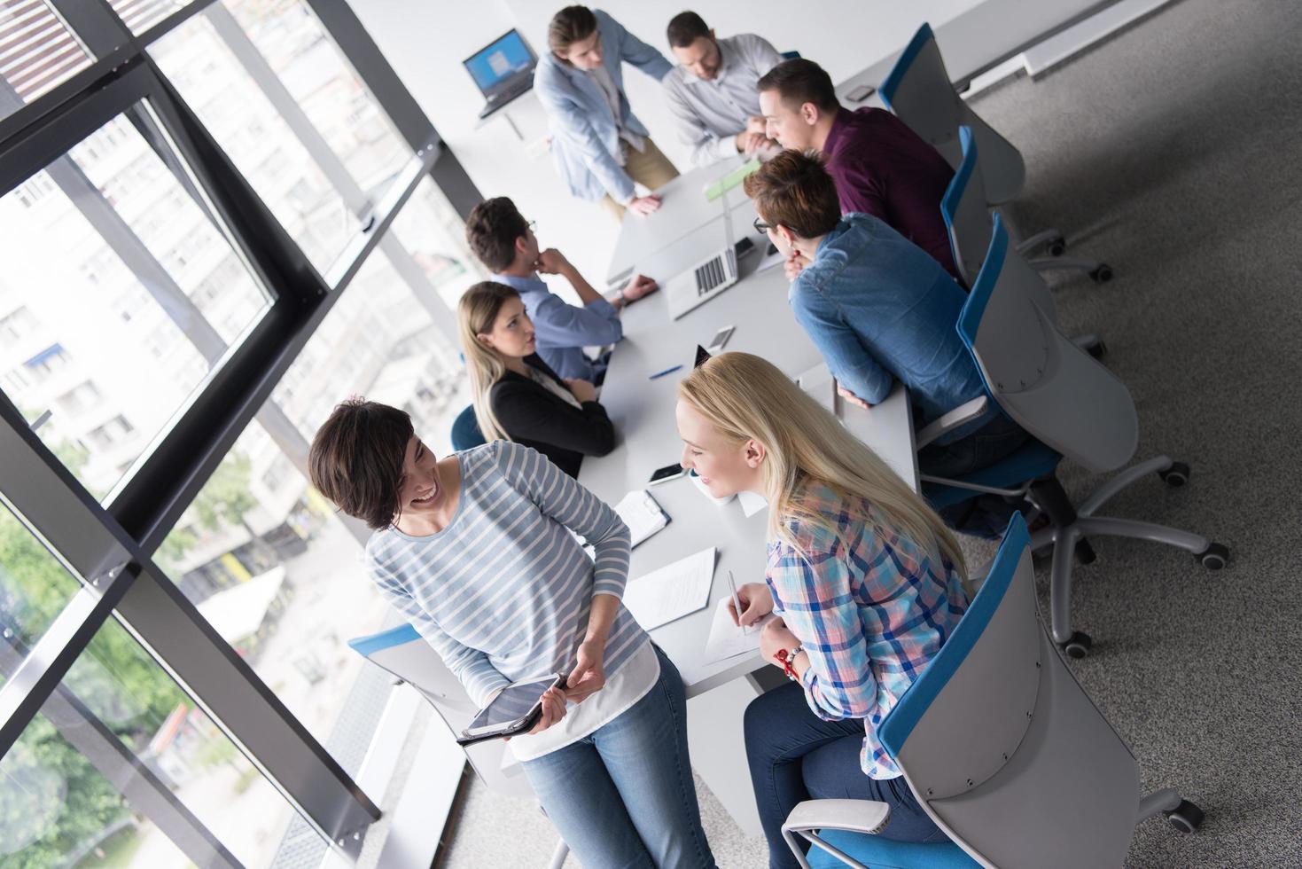 Pretty Businesswomen Using Tablet In Office Building during conference photo