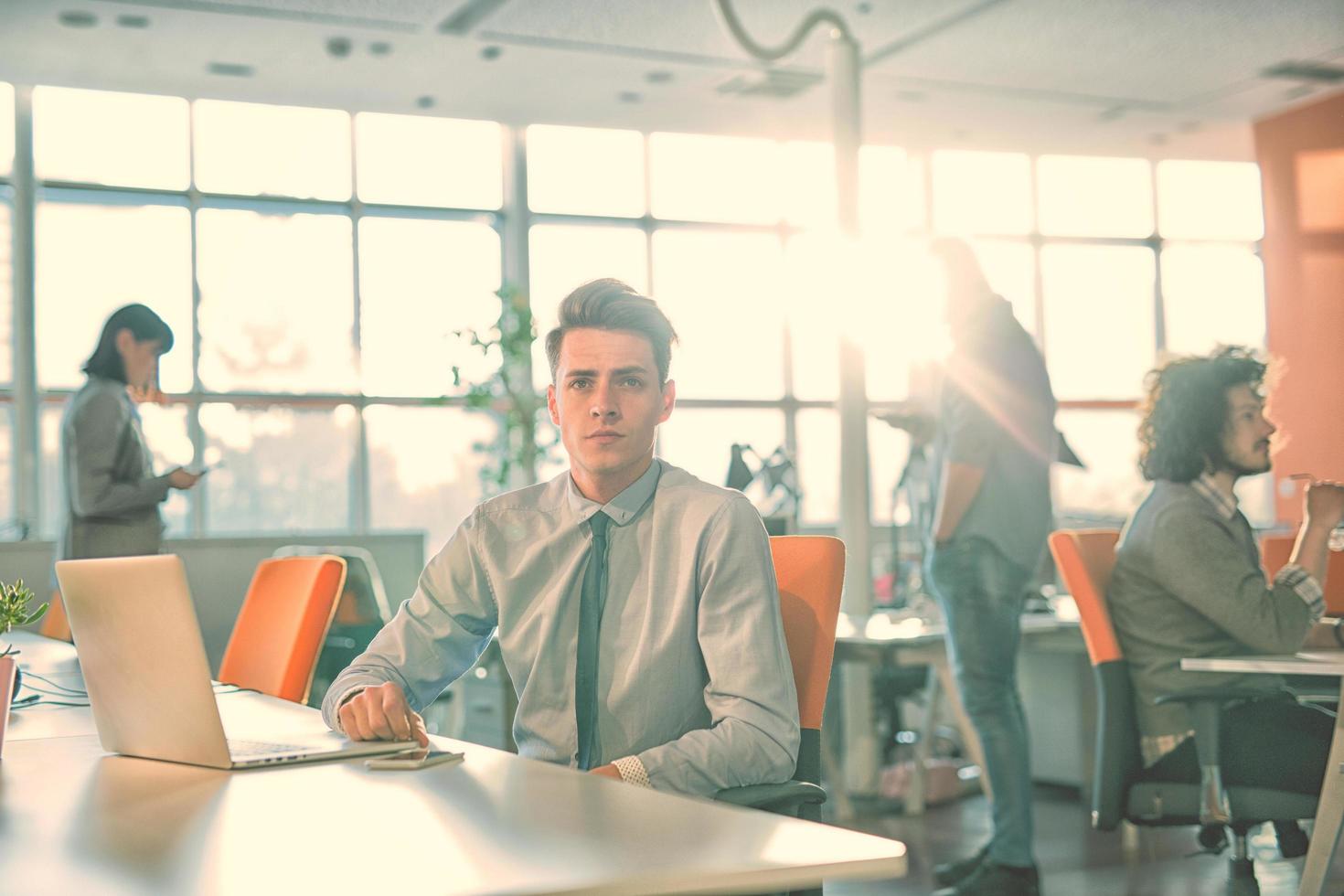 businessman working using a laptop in startup office photo