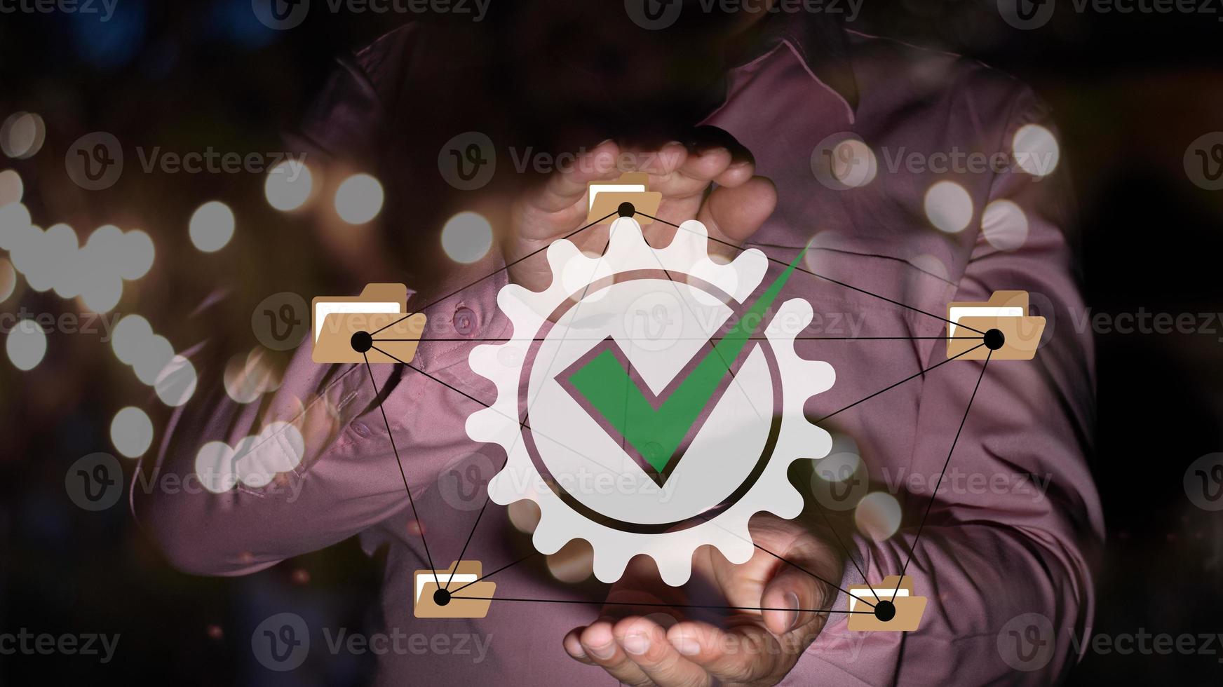 A businessman holding ISO certificate icon, file and folder connection, standard quality document control for organization and industry management products, document and paperless concept photo