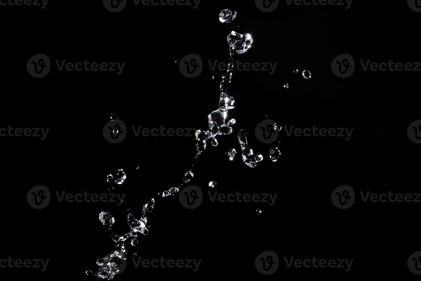 Water splash shot in studio, white water and black background, pure water for drink and food concept copy space for text and design photo