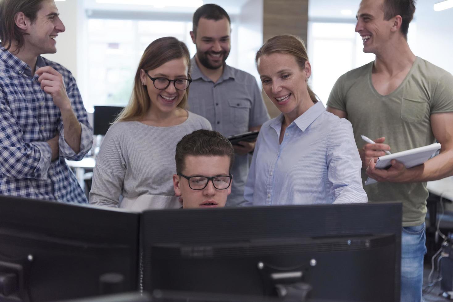 startup business people group working as team to find solution photo