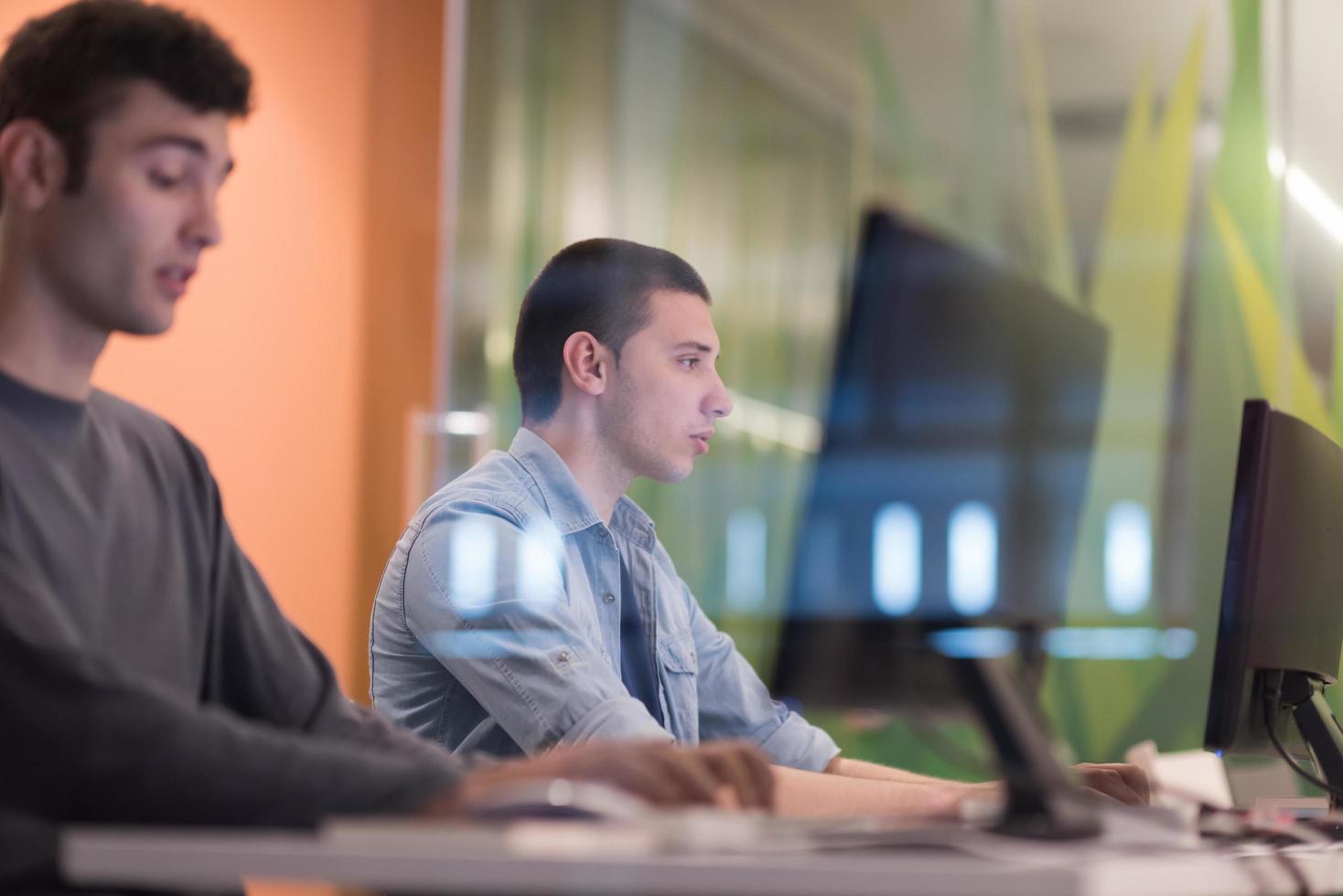 technology students group working  in computer lab school  classroom photo