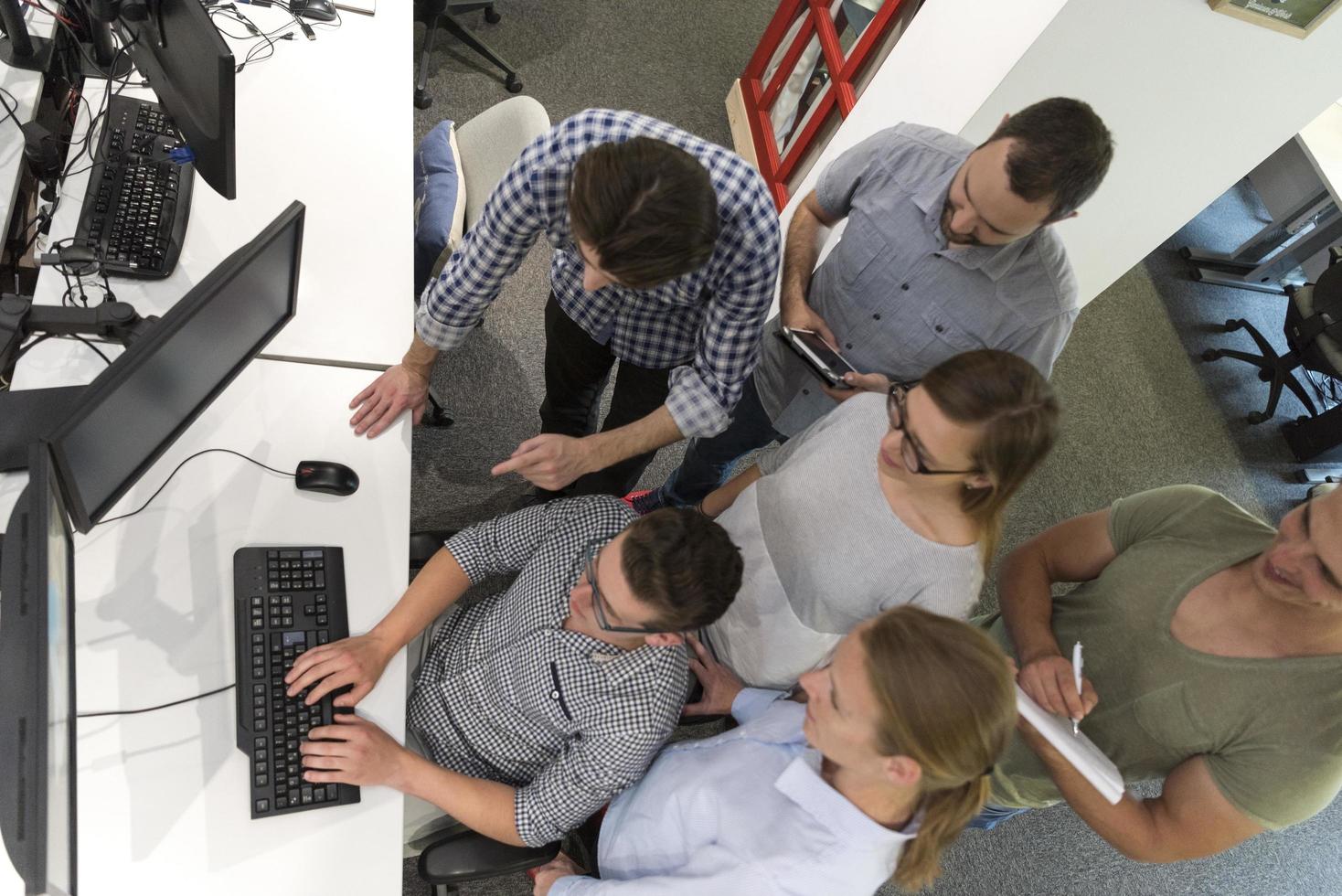 startup business people group working as team to find solution photo