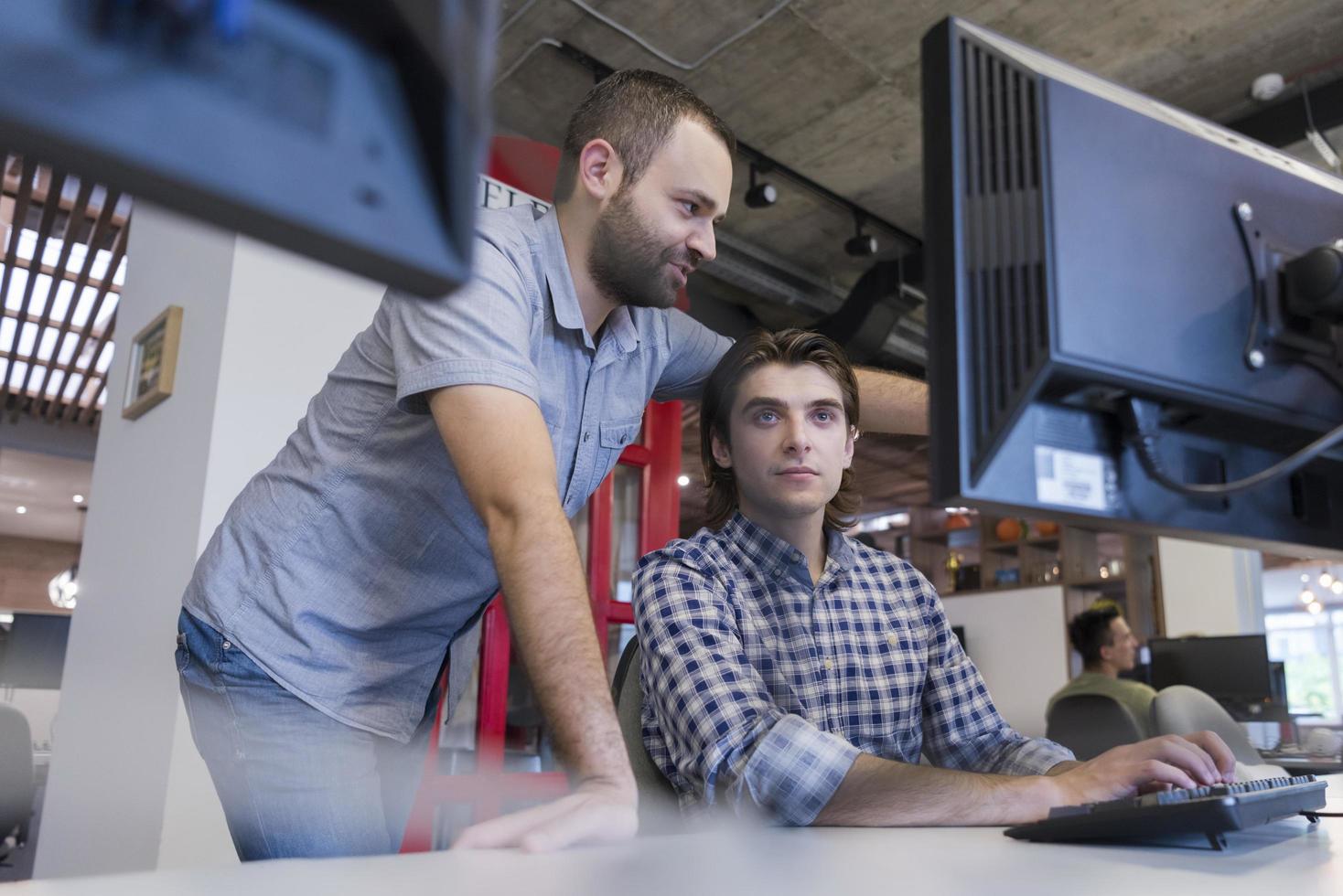 startup business people group working as team to find solution photo