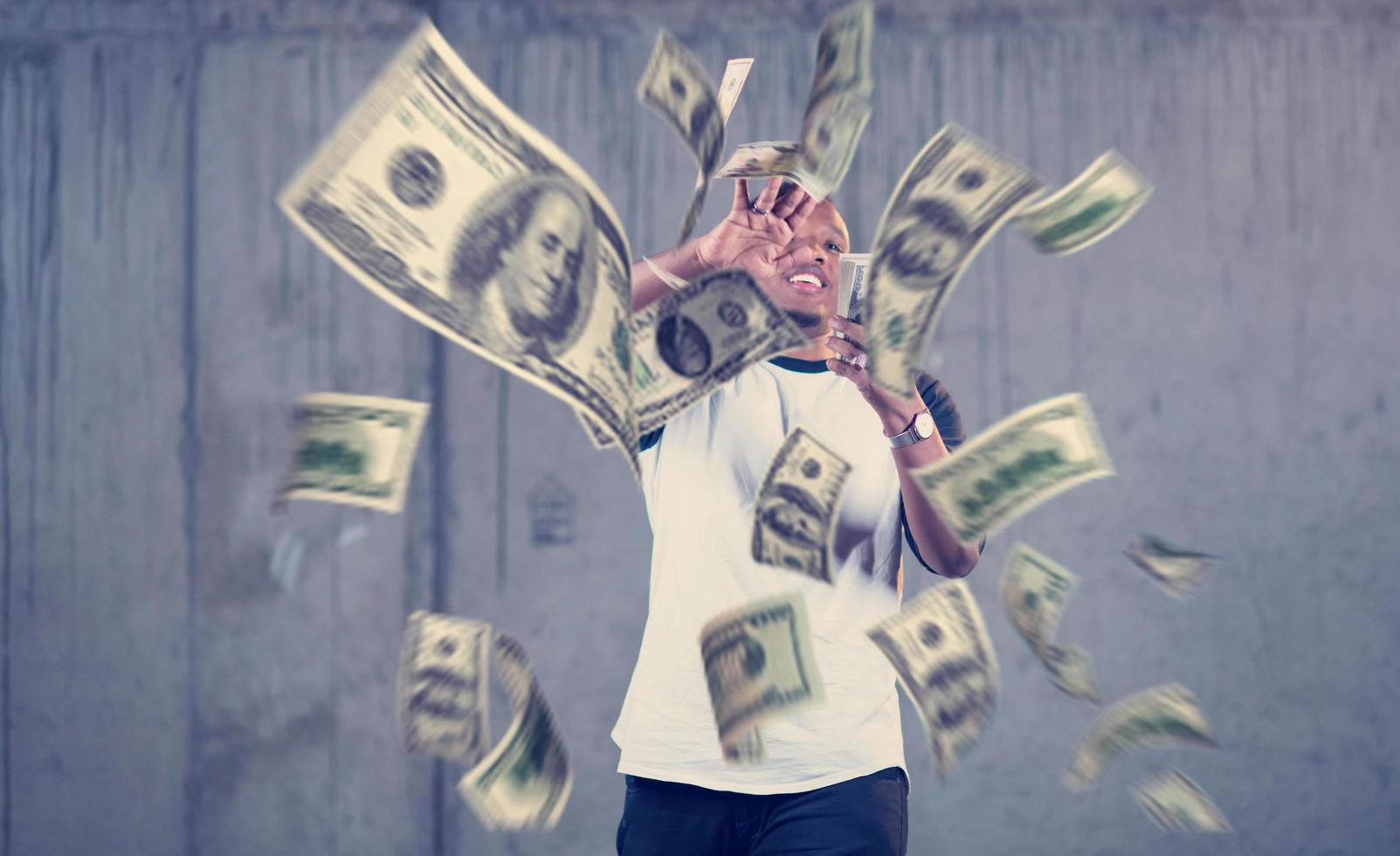 black businessman making the rain of money photo