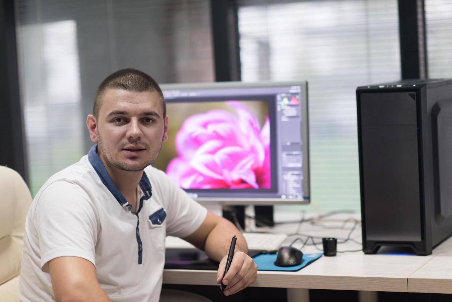 photo editor at his desk