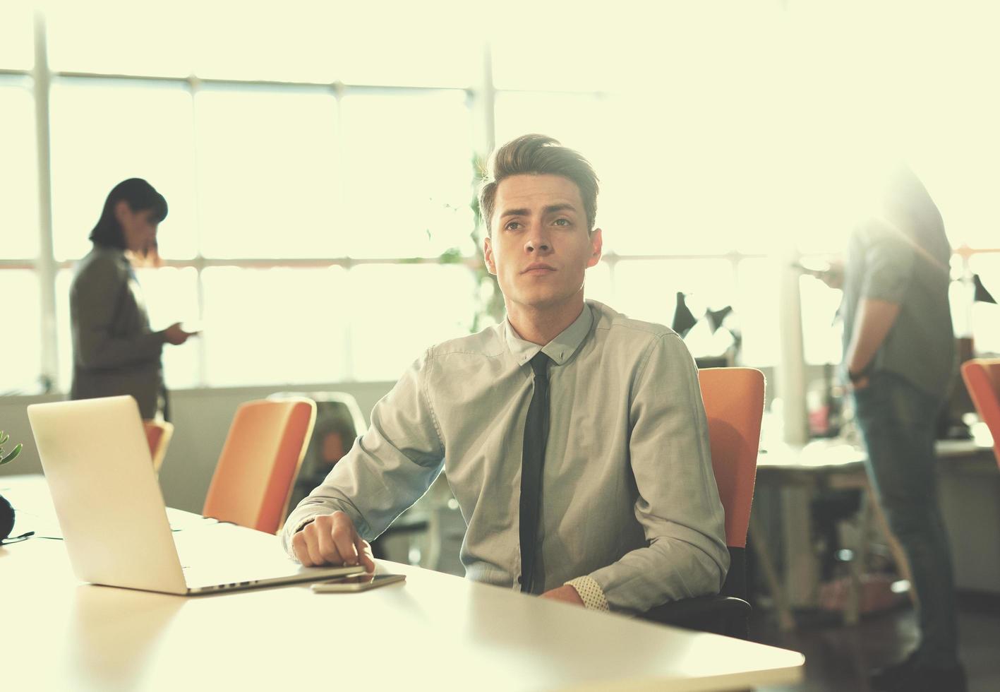 businessman working using a laptop in startup office photo