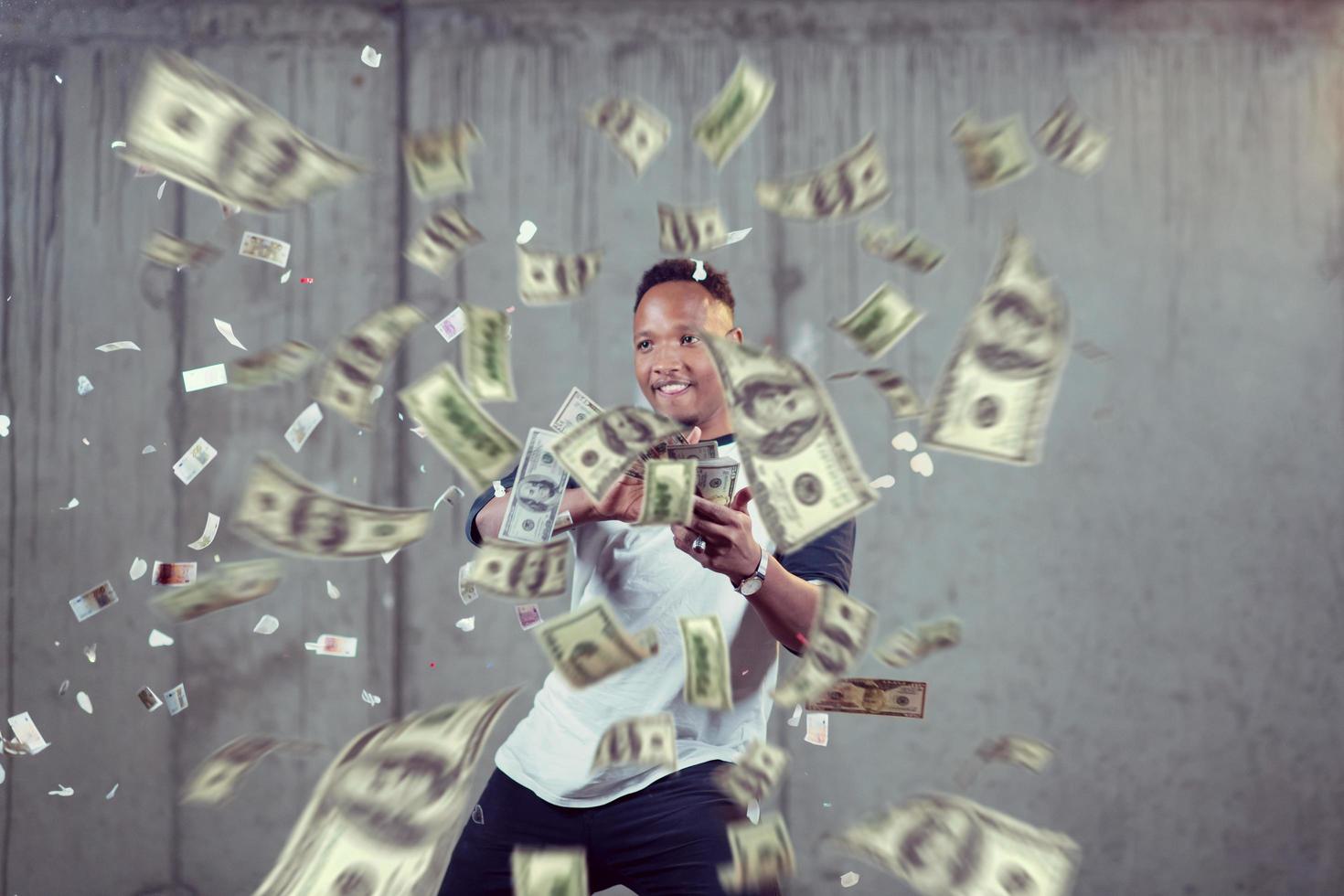 black businessman making the rain of money photo