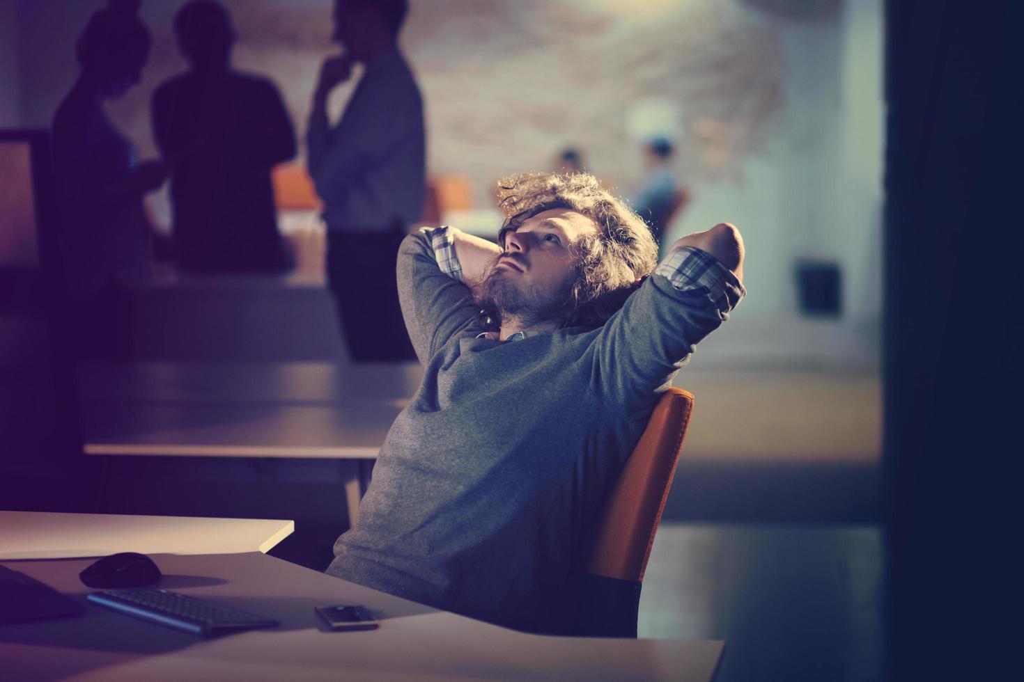 businessman relaxing at the desk photo