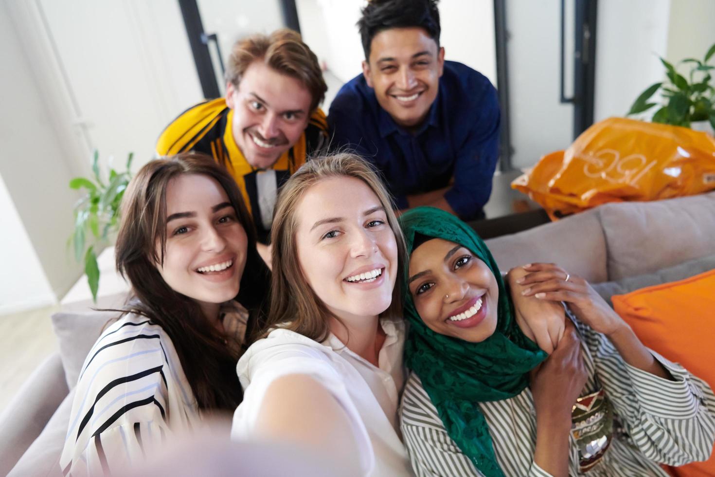 group of casual multiethnic business people taking selfie photo