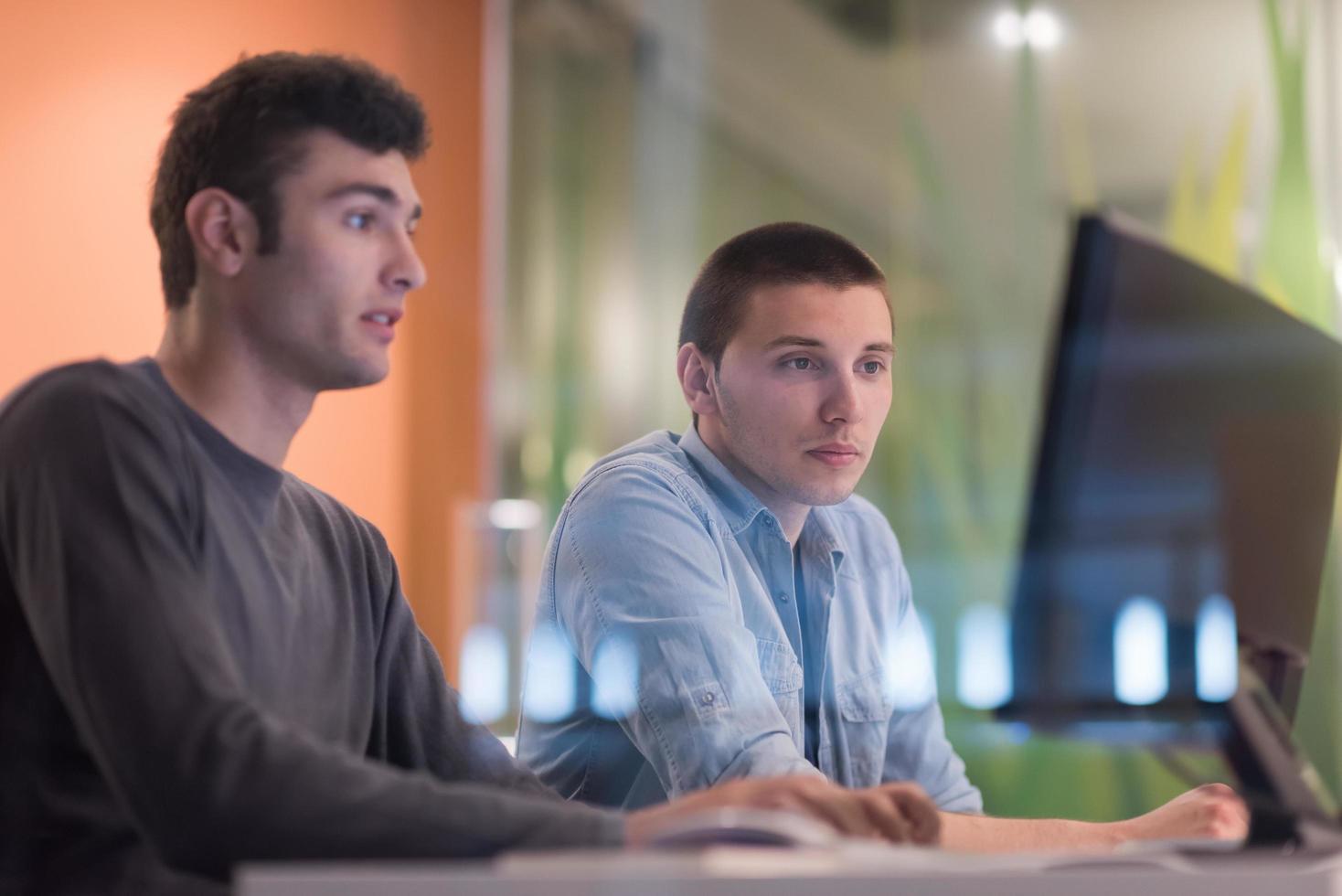 technology students group working  in computer lab school  classroom photo