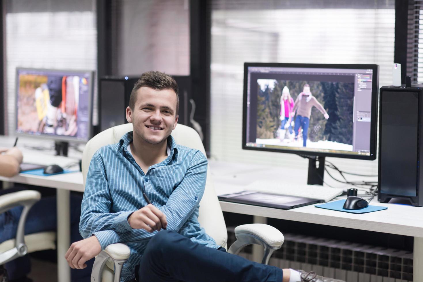 photo editor at his desk