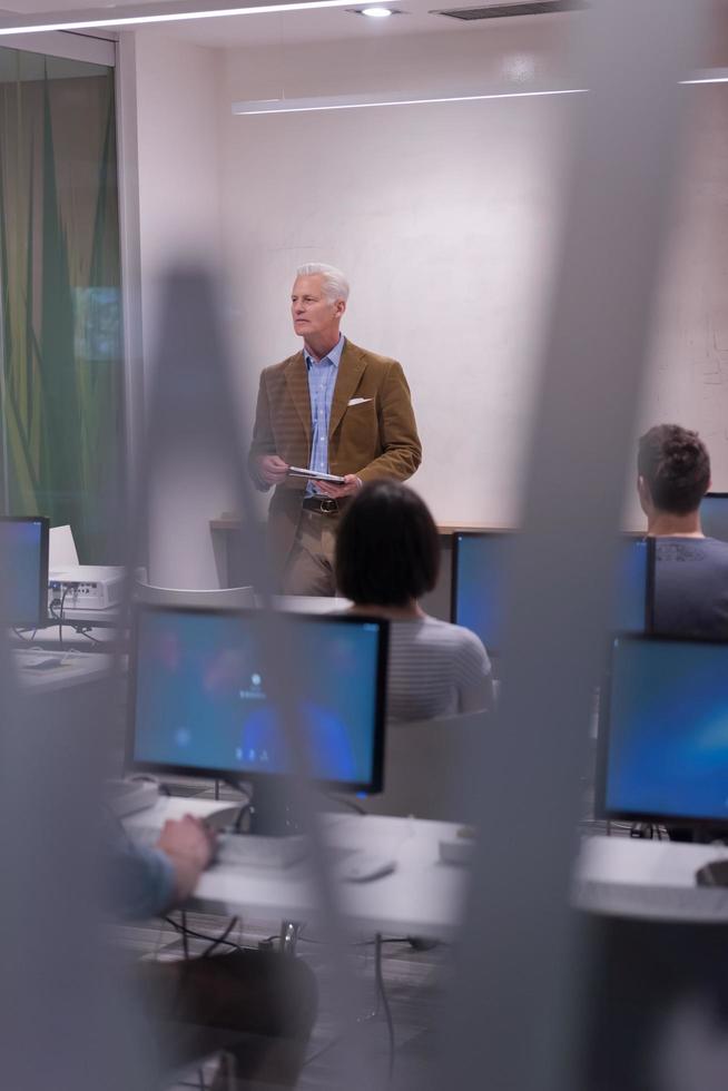 teacher and students in computer lab classroom photo