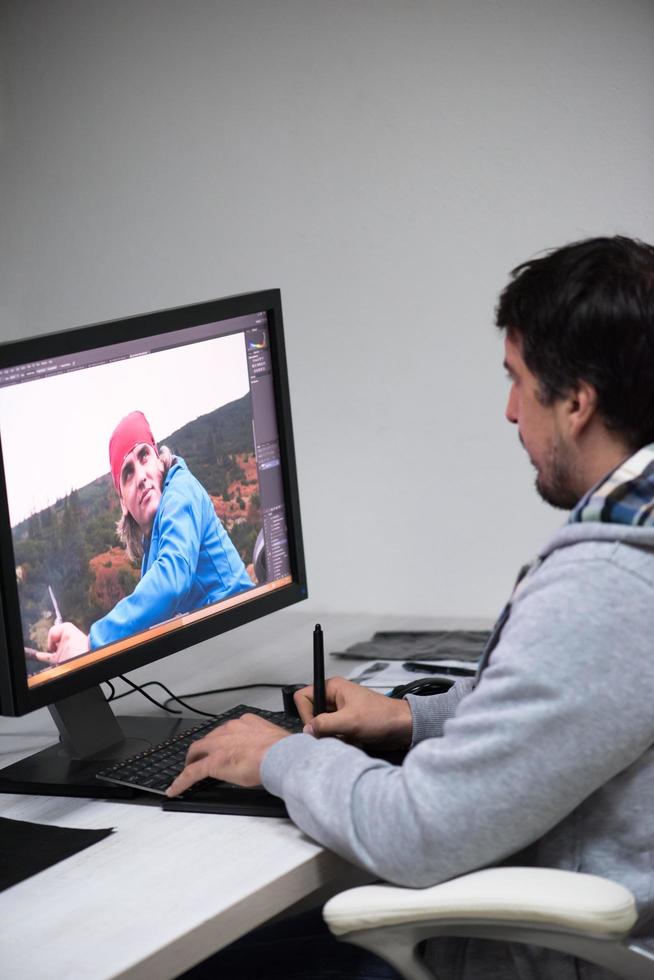 photo editor at his desk