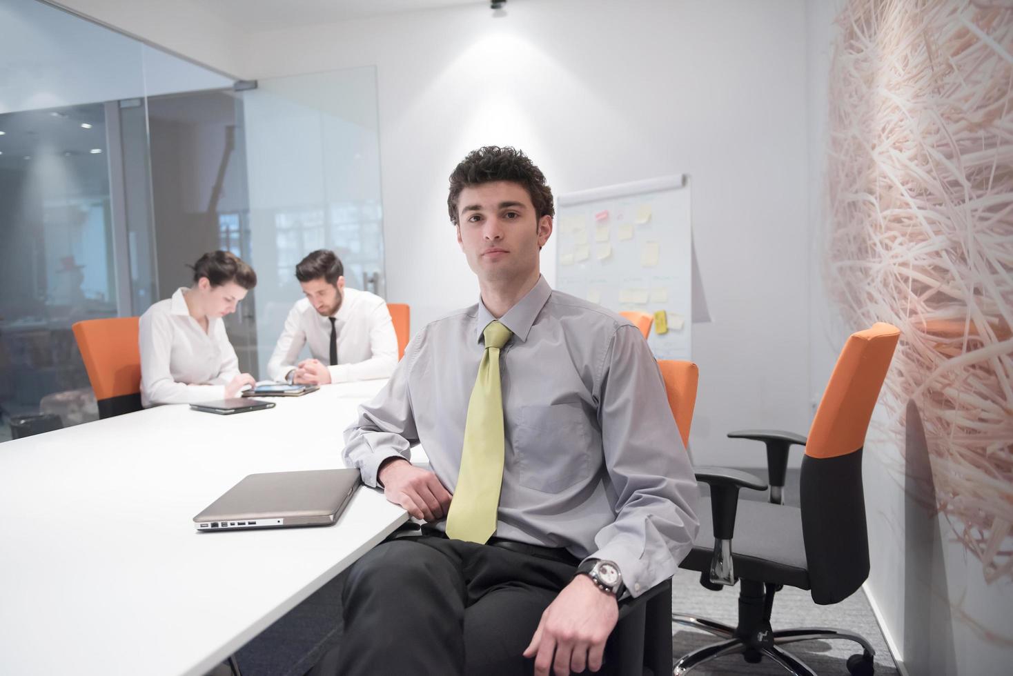 portrait of young business man at modern office photo