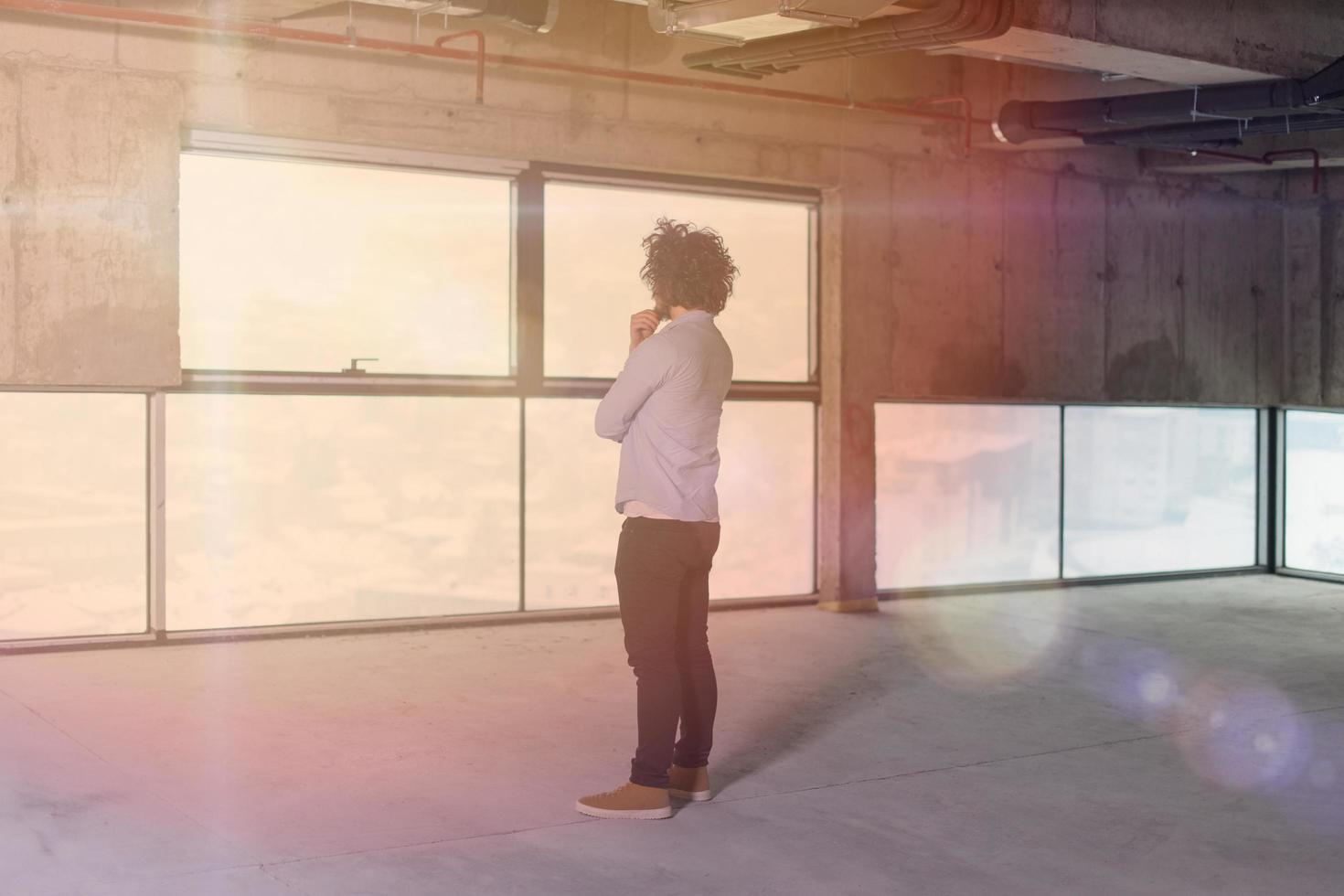 portrait of young male architect on construction site photo