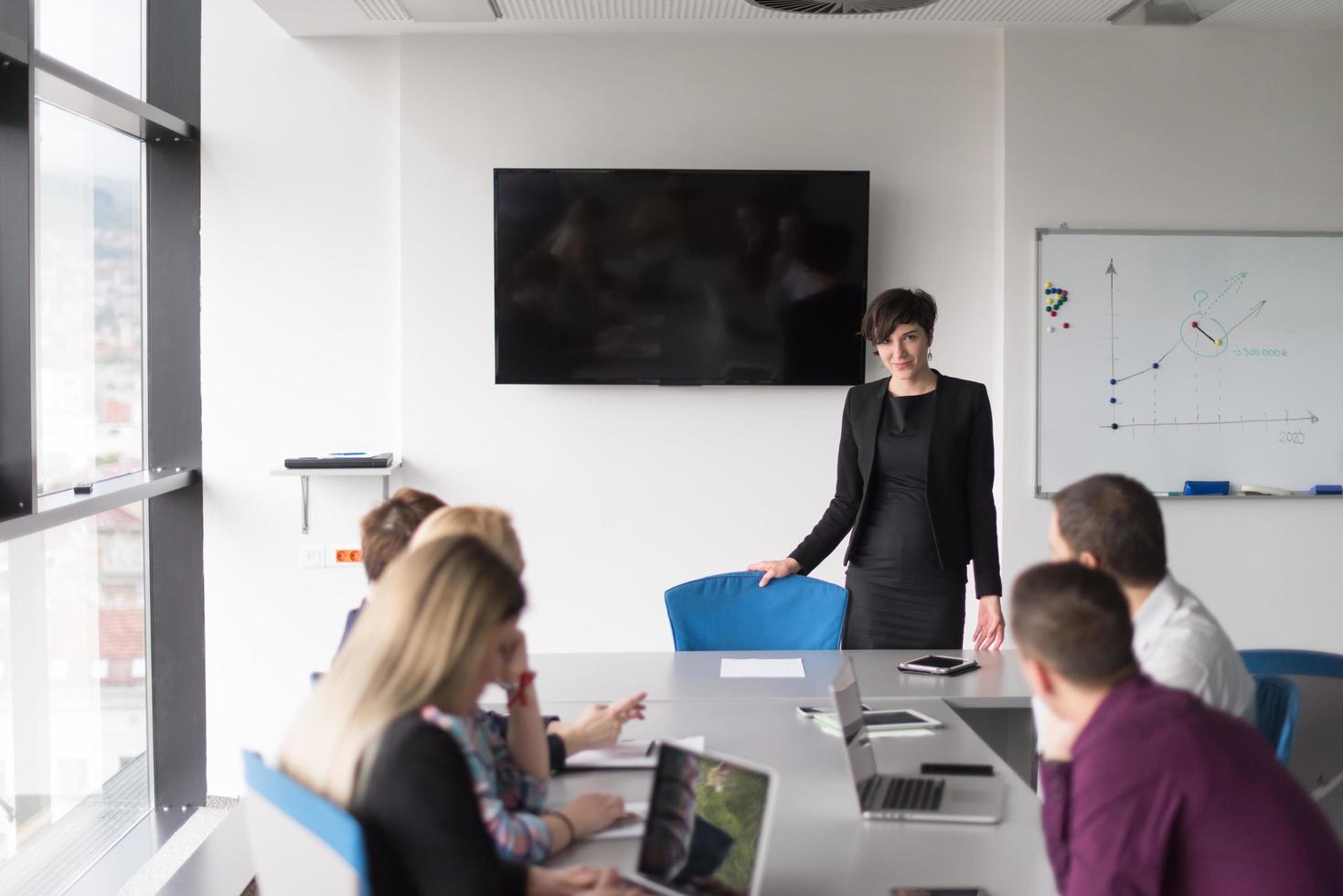 Group of young people meeting in startup office photo