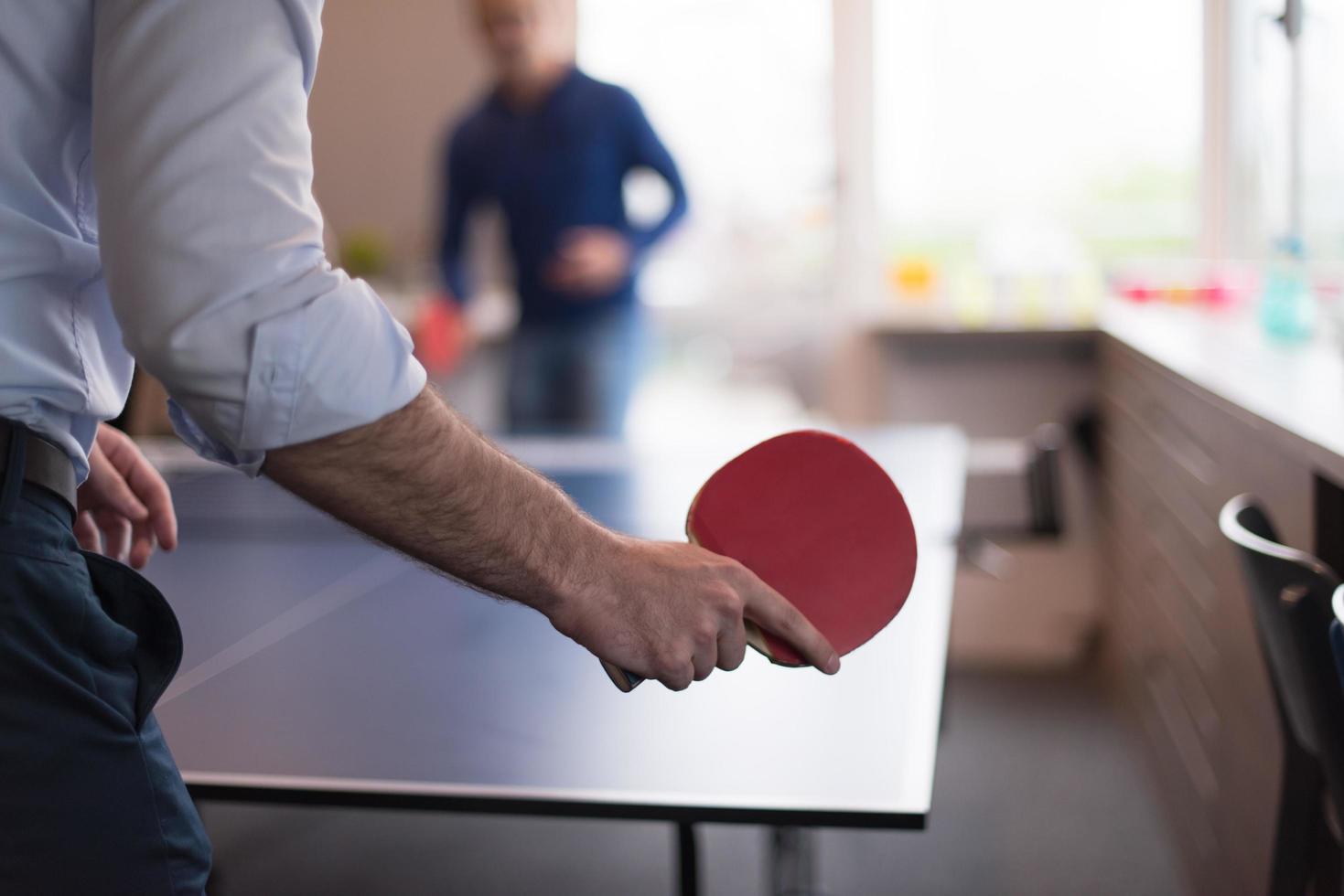 startup business team playing ping pong tennis photo