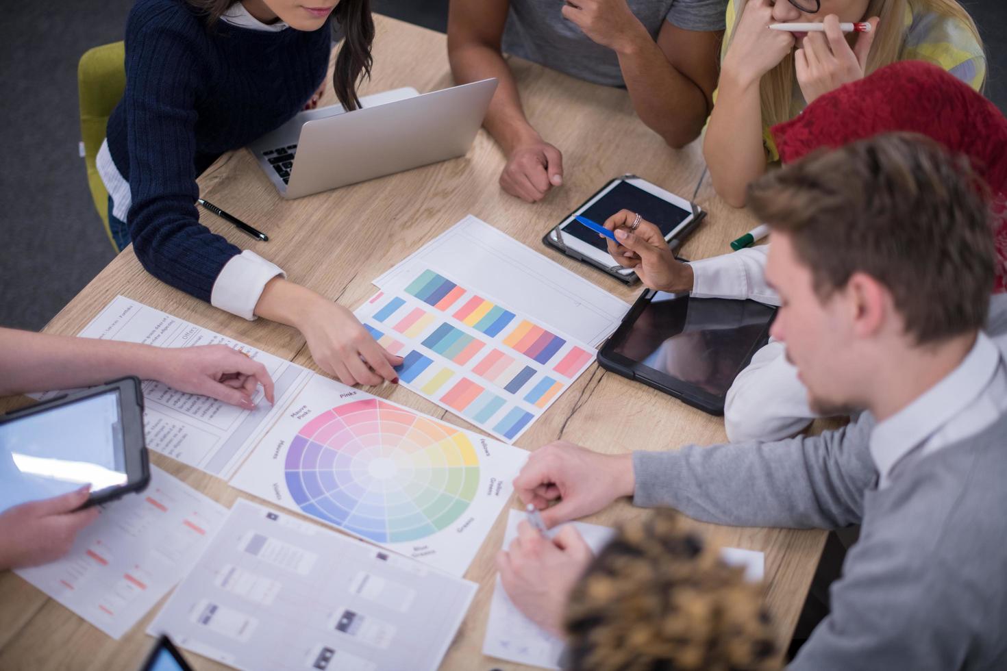 Multiethnic startup business team having meeting photo