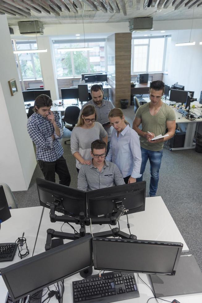 startup business people group working as team to find solution photo