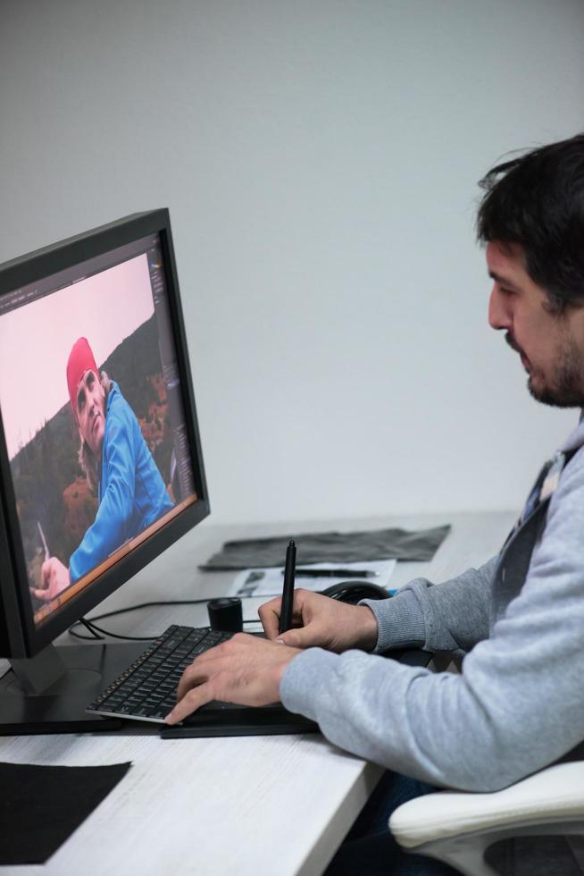 photo editor at his desk