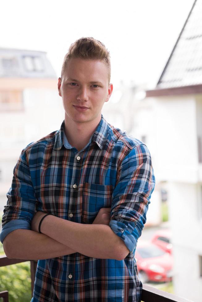 man standing at balcony photo