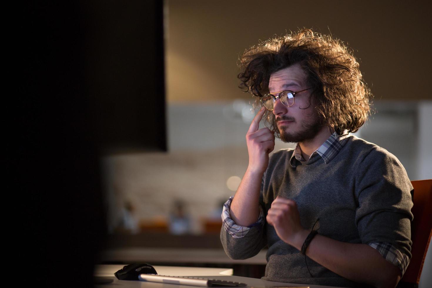 businessman relaxing at the desk photo