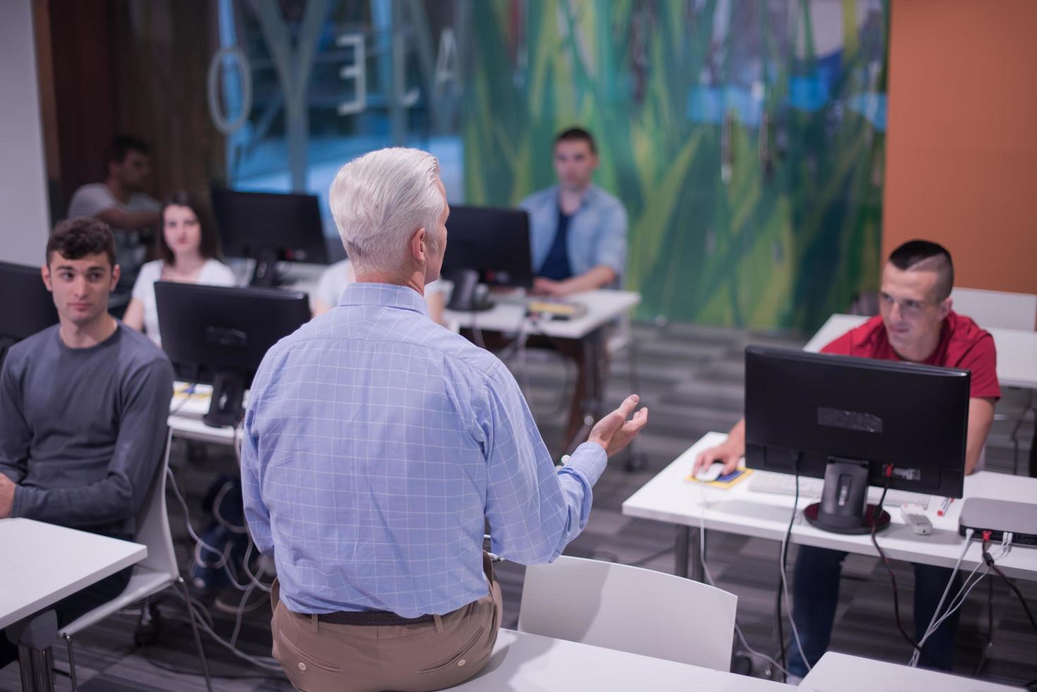 teacher and students in computer lab classroom photo