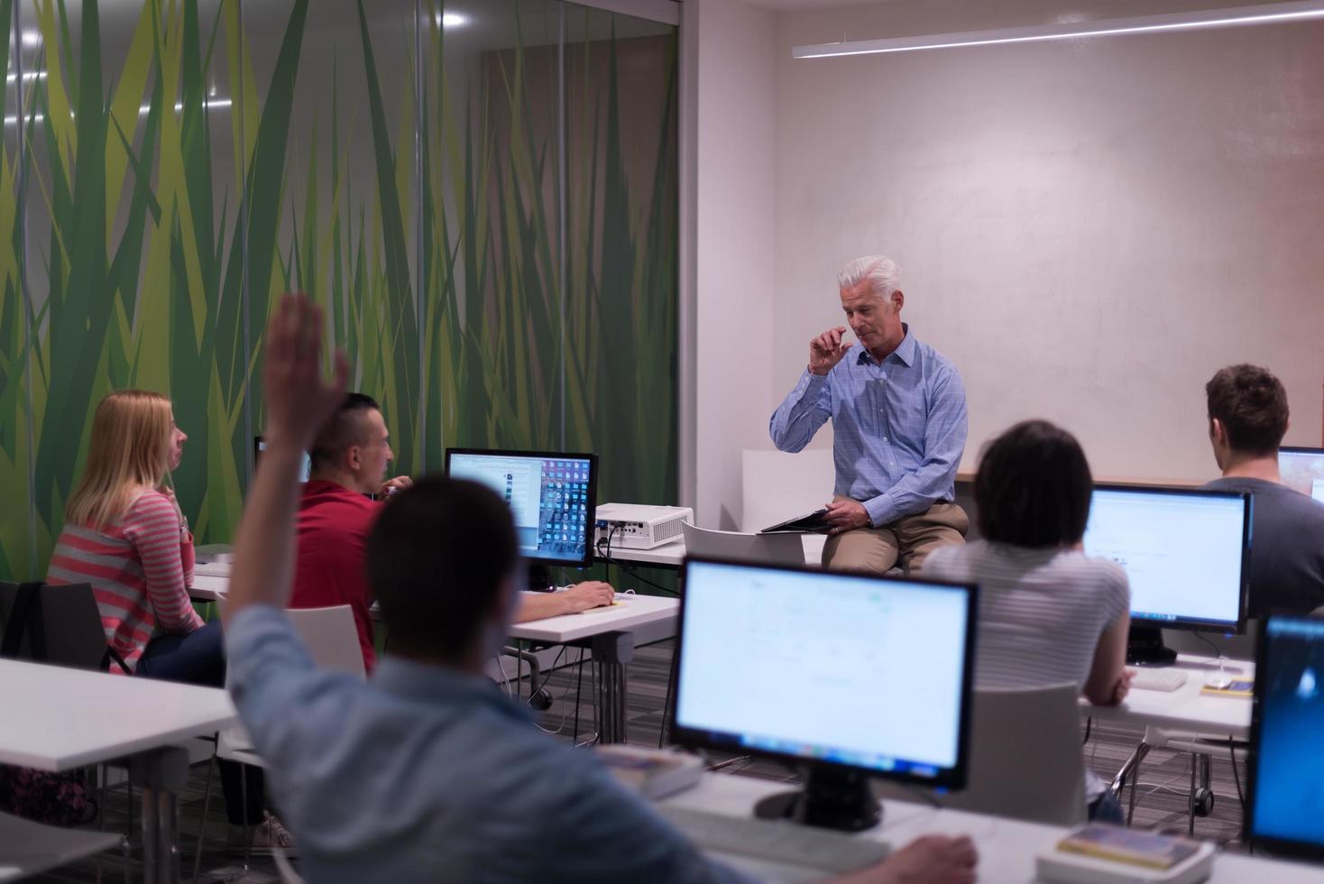 teacher and students in computer lab classroom photo