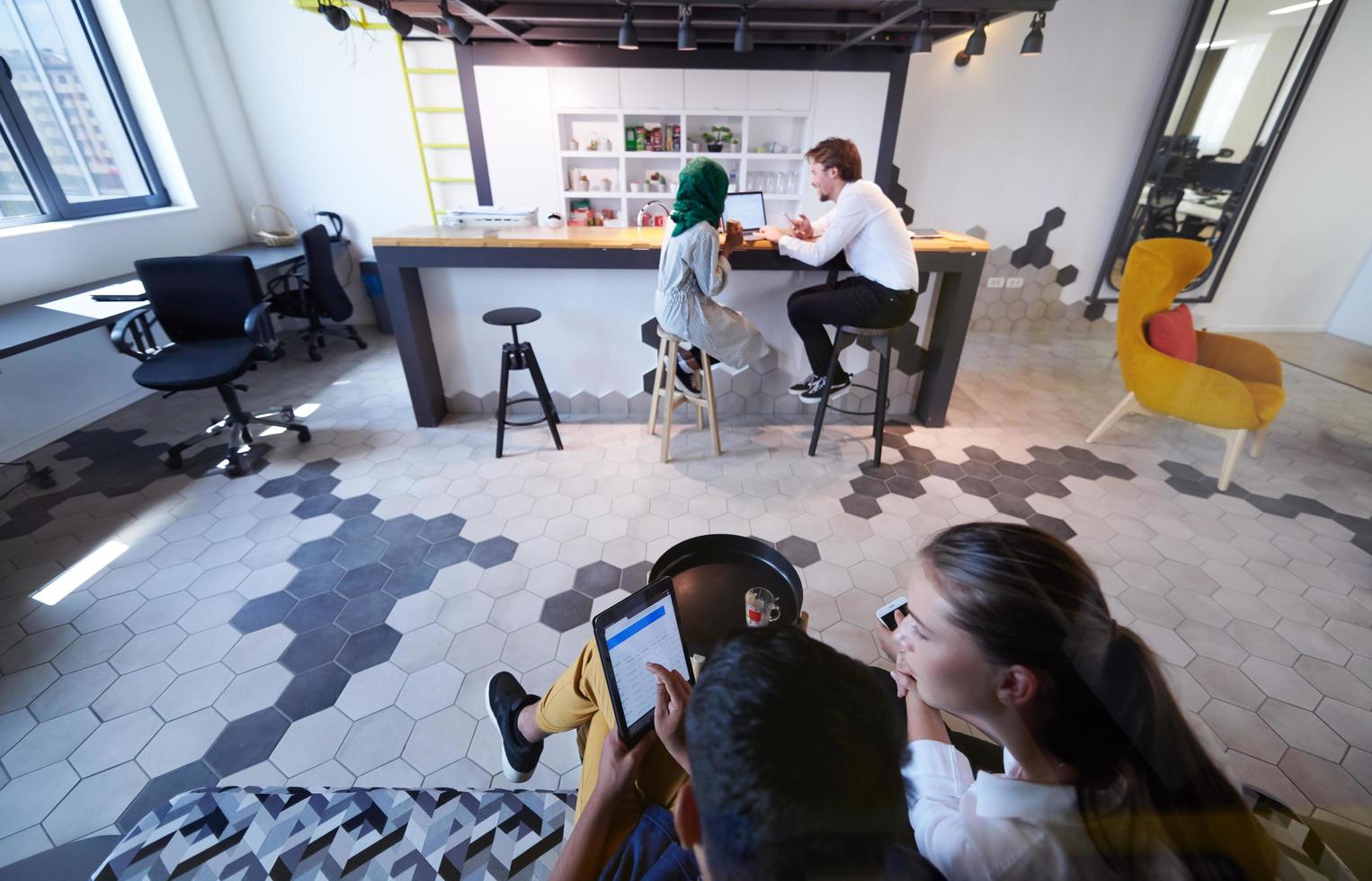 group of casual multiethnic business people taking break from the work photo