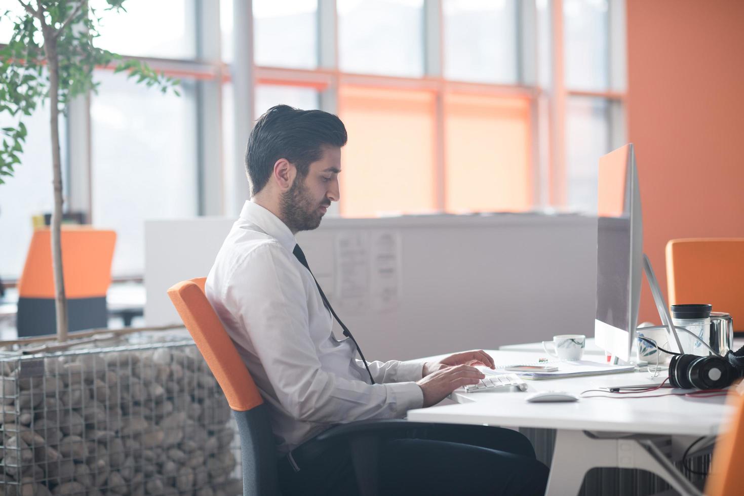 young business man  working on desktop computer photo