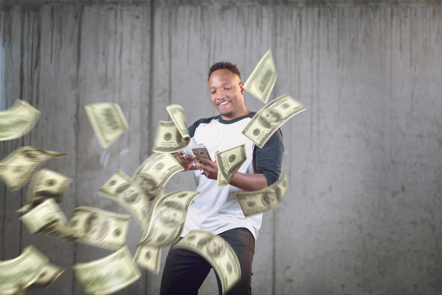 black businessman making the rain of money photo