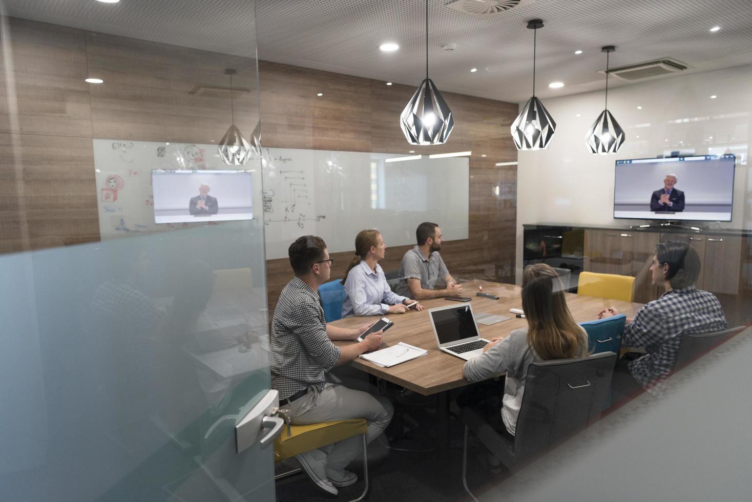 start up business people group attending videoconference call photo