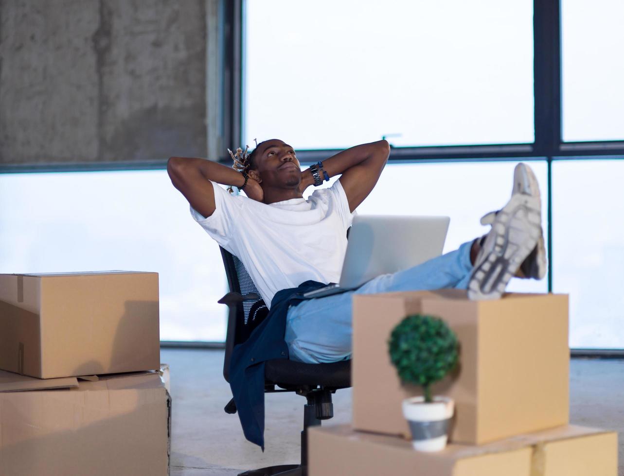 young black male architect taking a break on construction site photo